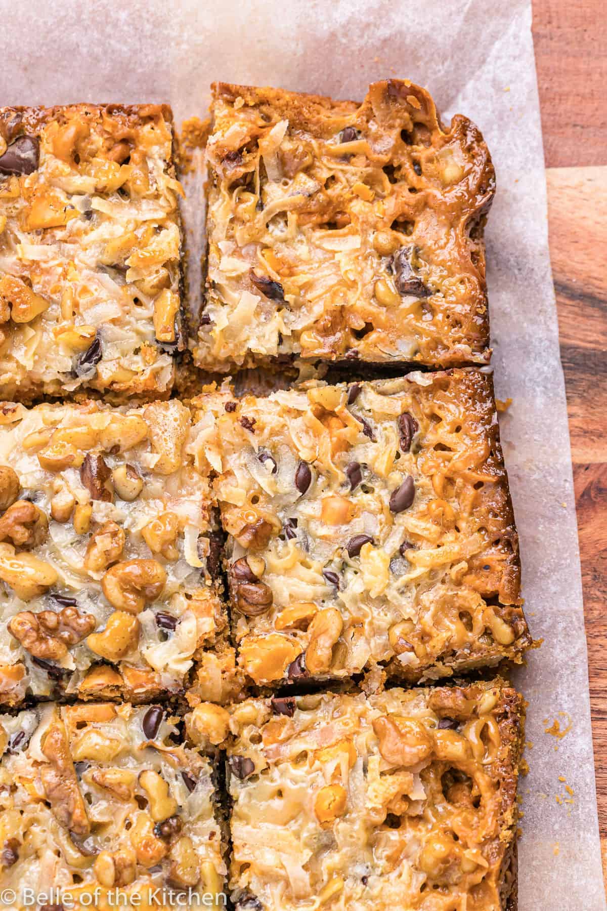 seven layer bars on a piece of parchment paper