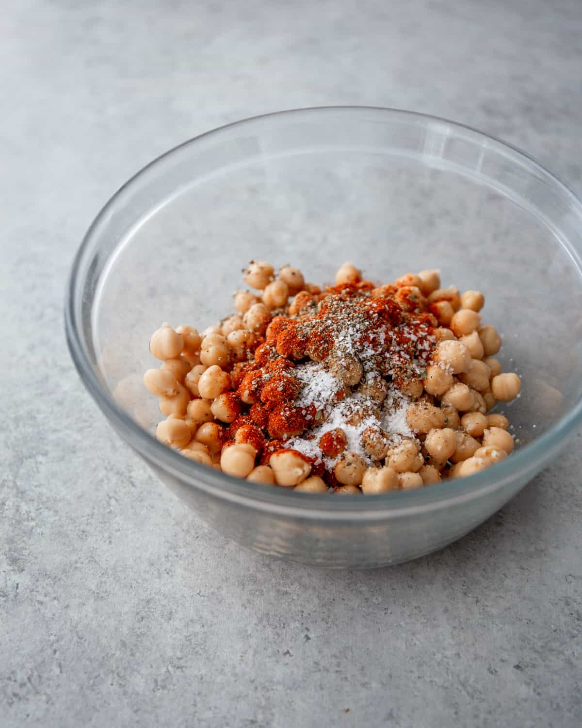 chickpeas and spices in a glass mixing bowl