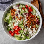 overhead image of green goddess salad in a white bowl