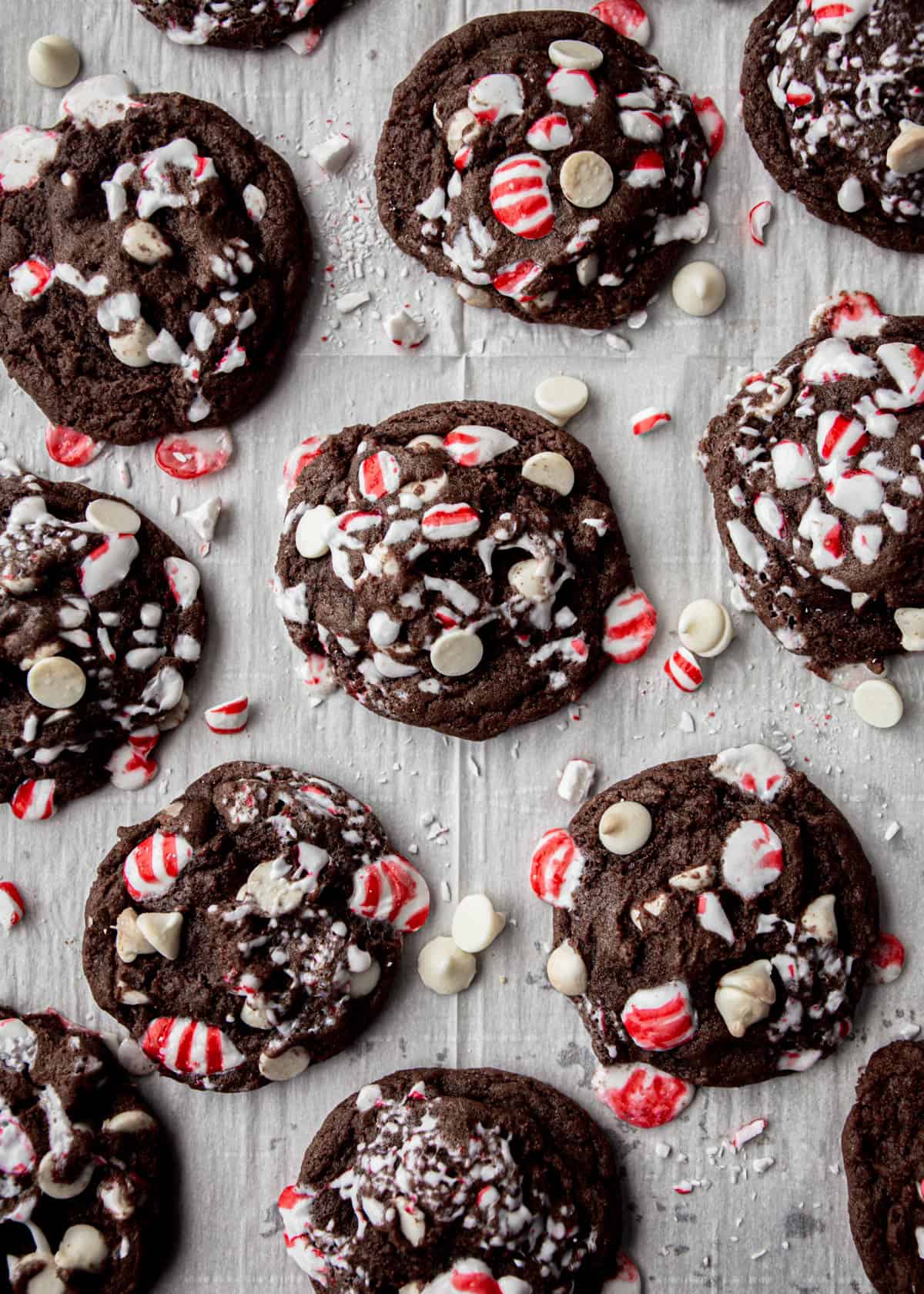chocolate cookies with peppermint pieces on a white napkin