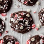 overhead image of a chocolate and peppermint cookie on a parchment lined sheet pan