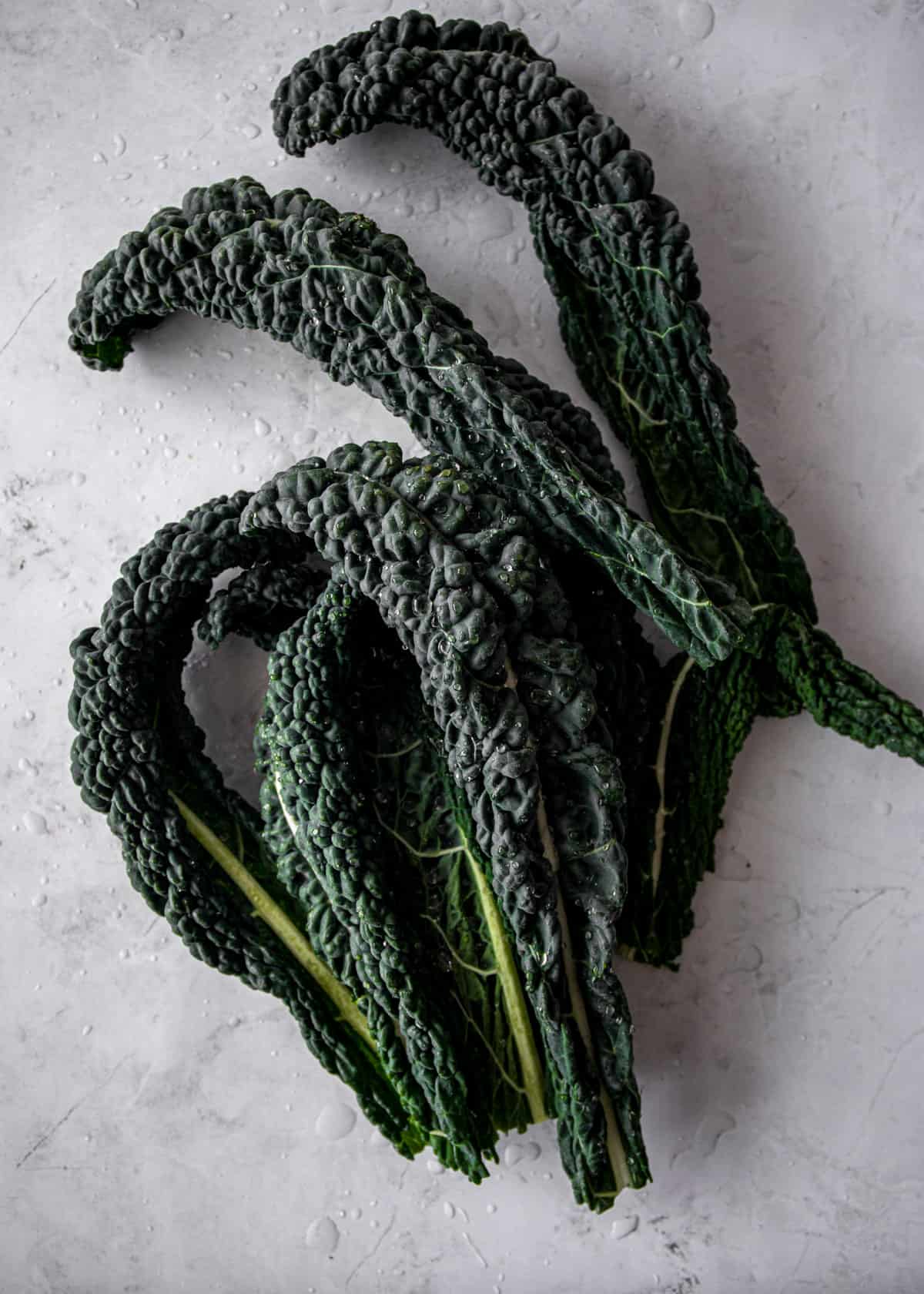 fresh kale on a white countertop