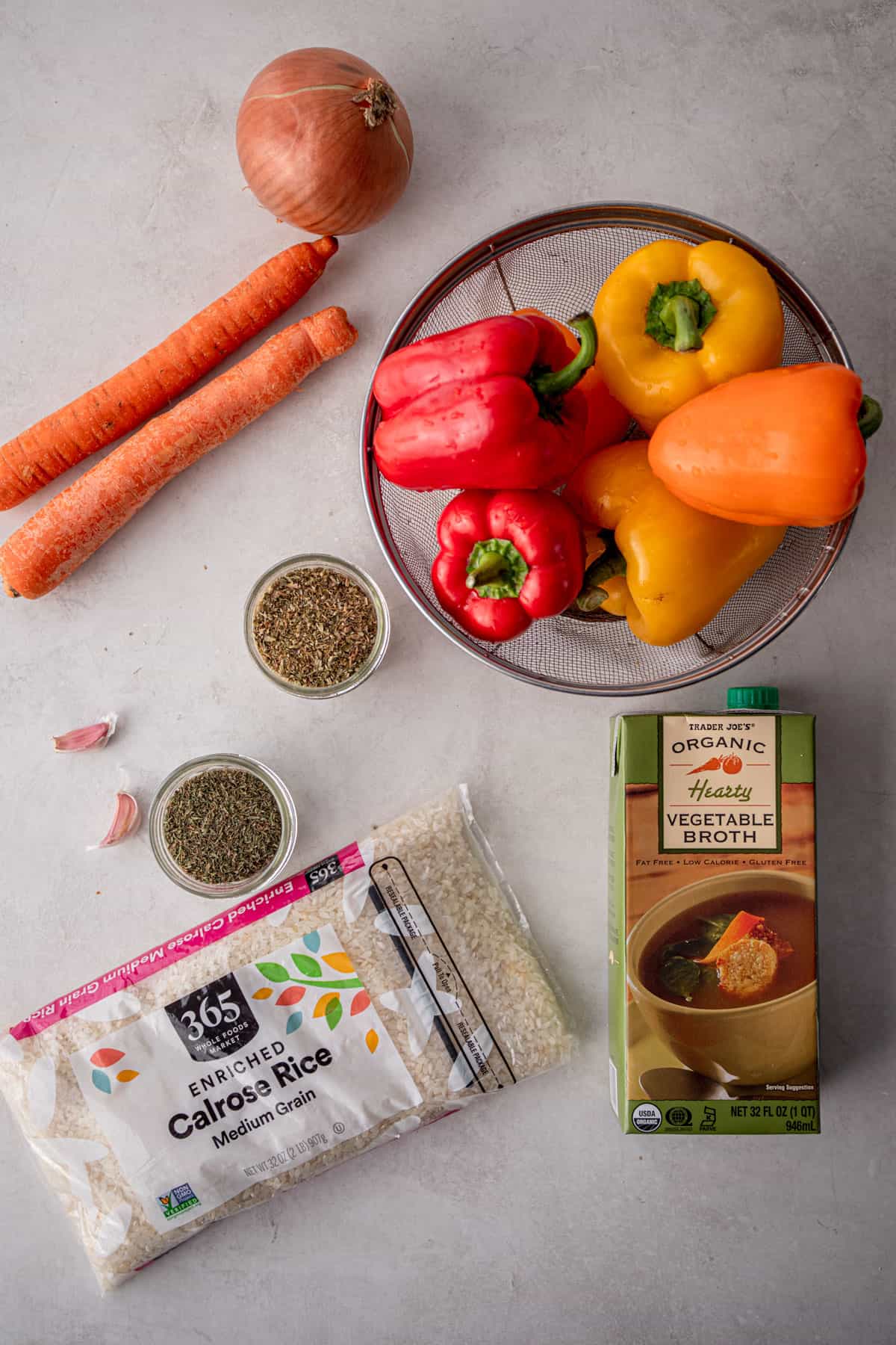 overhead image of ingredients for stuffed peppers on a grey countertop