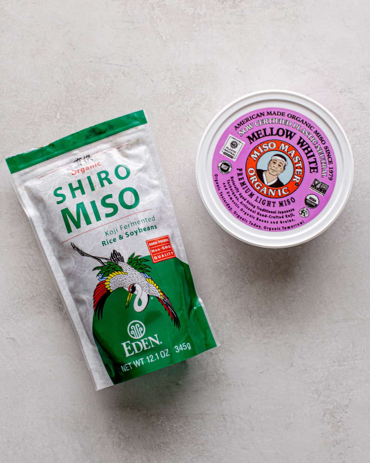 overhead image of different miso packs on a grey countertop