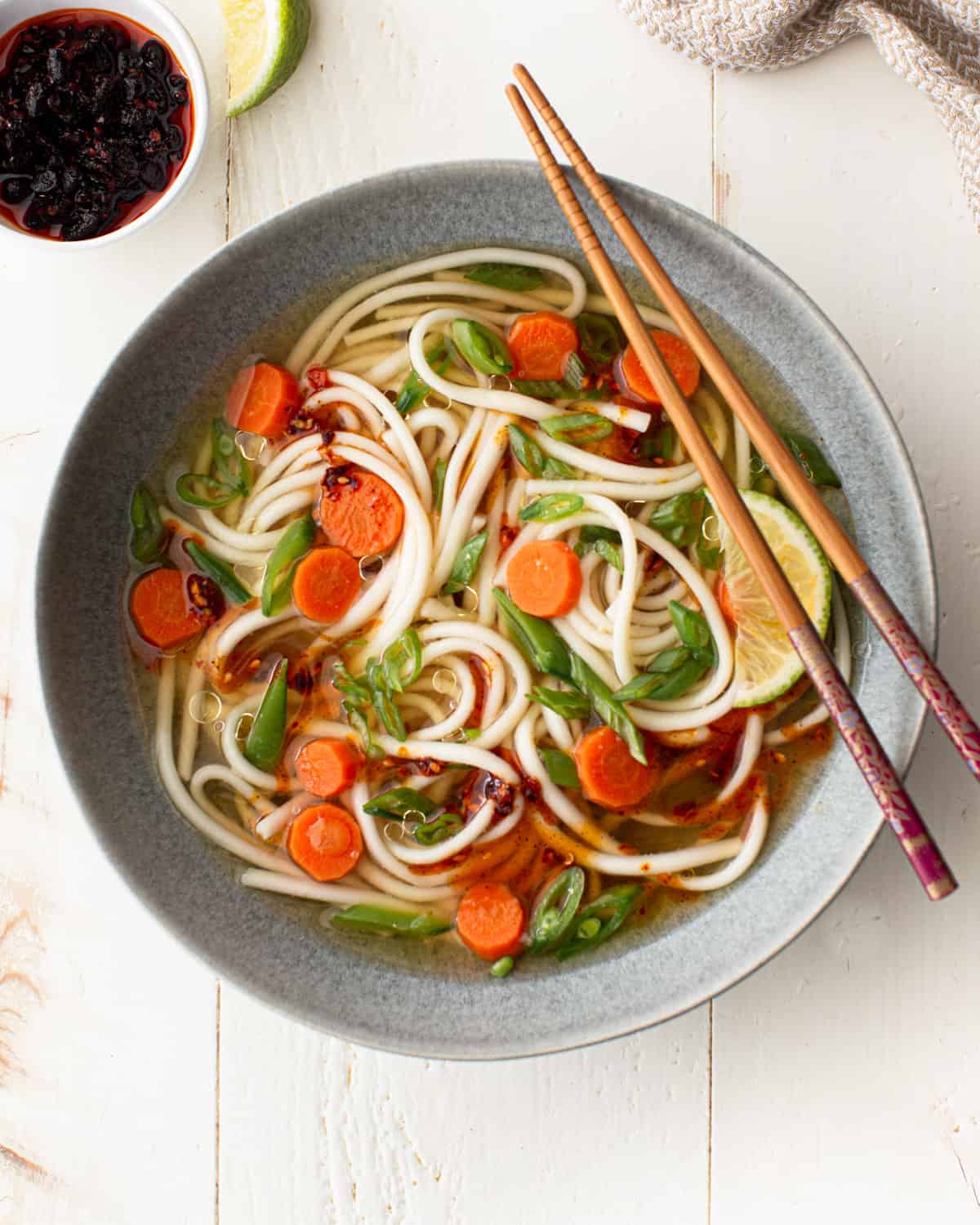 soup with vegetables and noodles in a grey bowl