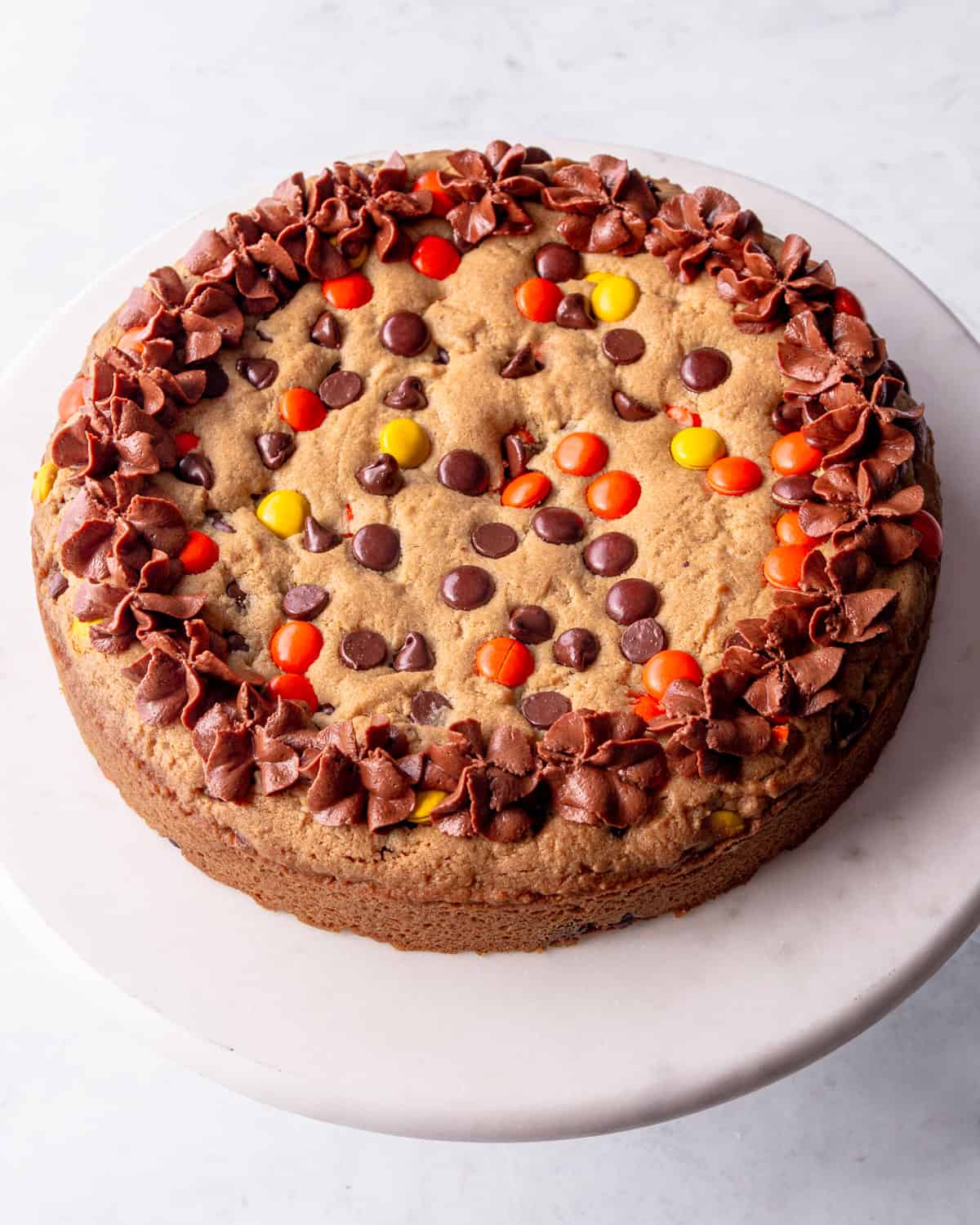 cookie cake on a round cake plate