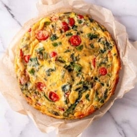 a baked frittata on a marble countertop