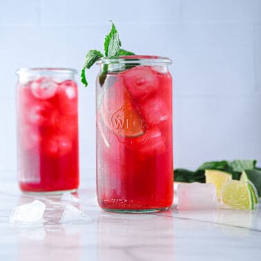 hibiscus iced tea in glasses on a white marble countertop