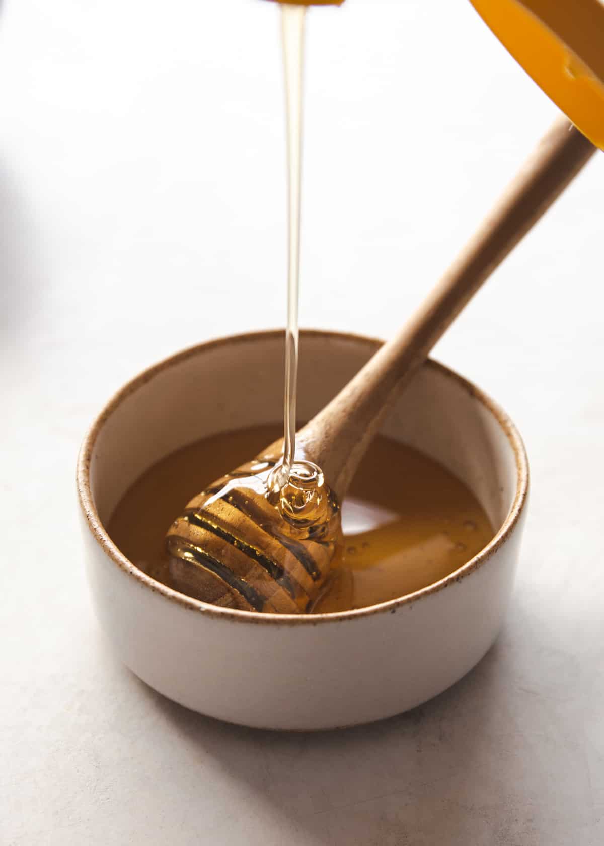 making honey sauce in a small saucepan