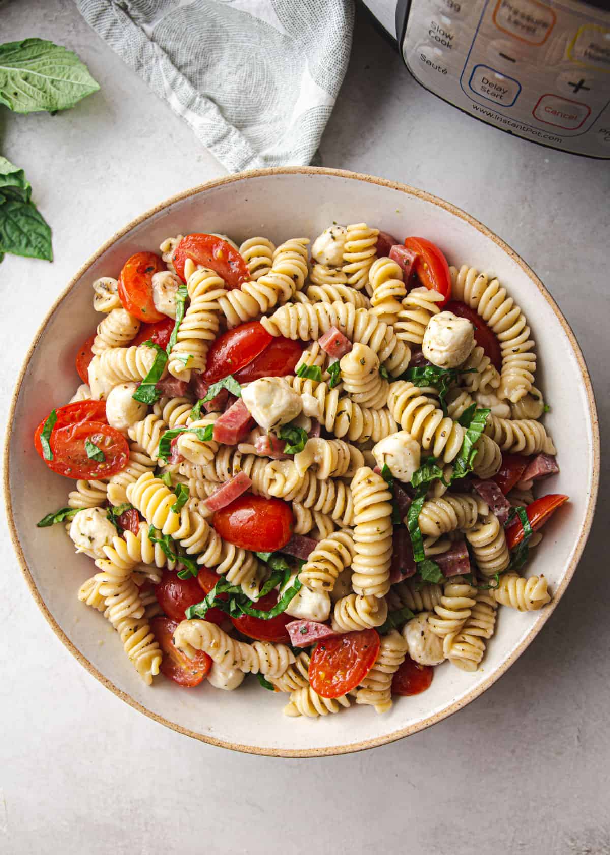 overhead image of pasta salad in a grey bowl