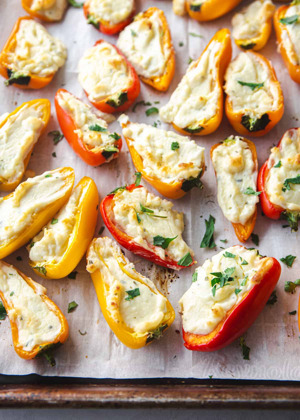 cooked stuffed peppers on a sheet pan