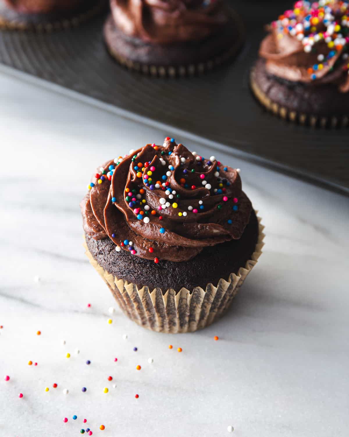 chocolate cupcake on a grey countertop