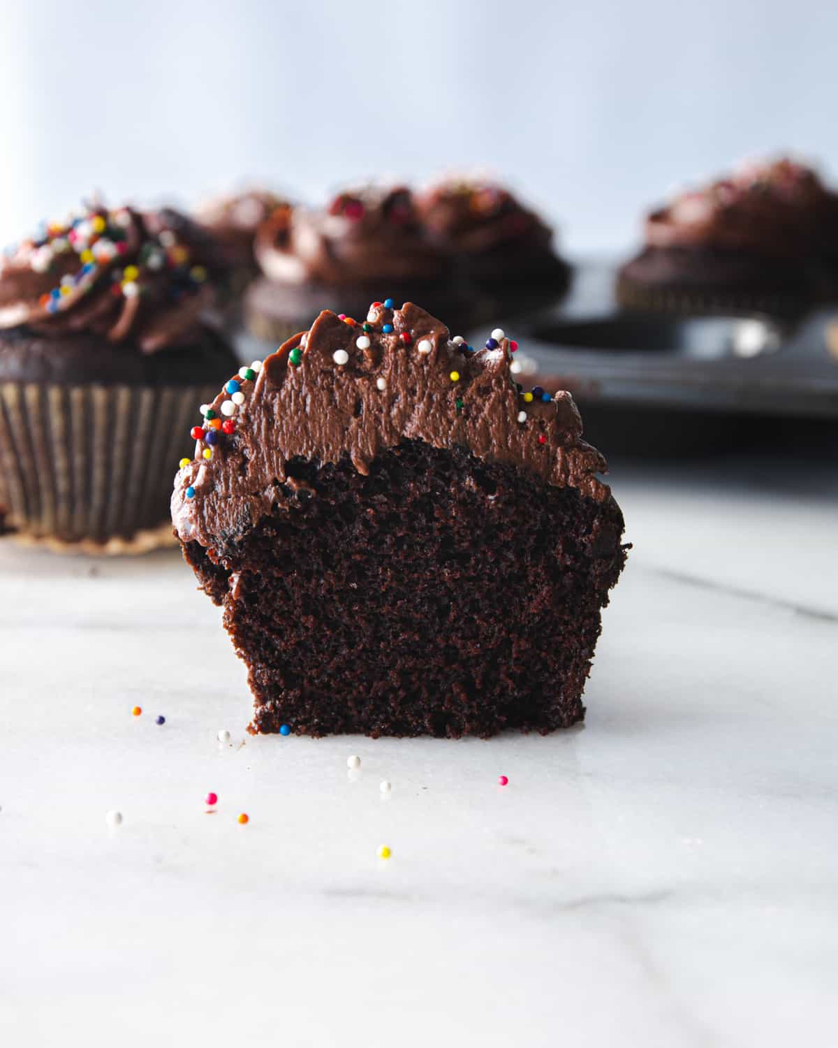 a side view of a frosted cupcake cut in half