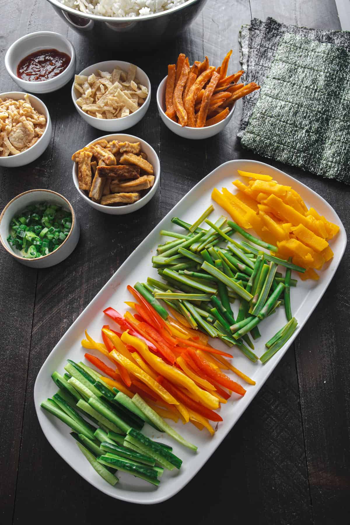 fresh sliced vegetables on a white tray