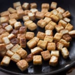 crispy tofu in a nonstick pan