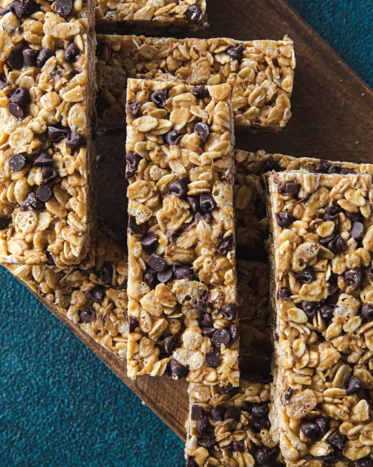 granola bars stacked on a wooden tray