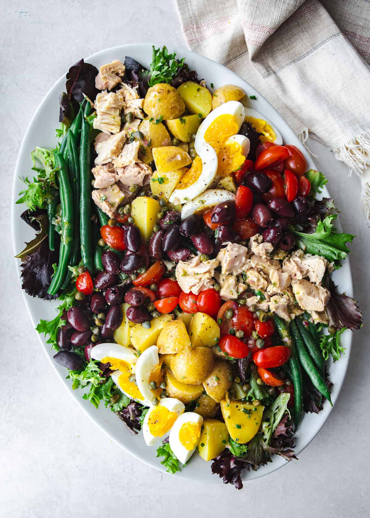 tuna nicoise salad on a white platter