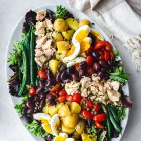 tuna nicoise salad on a white oval platter