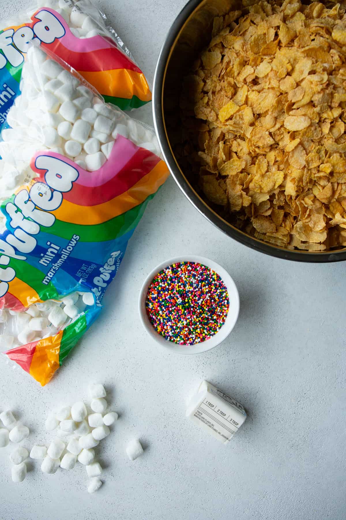 ingredients for a cornflake treats on a grey countertop