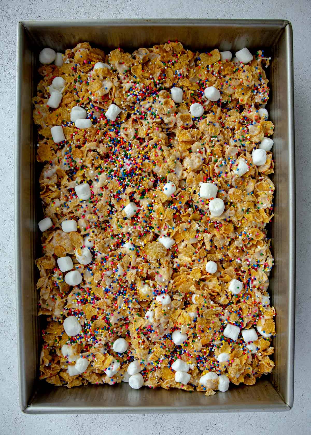 marshmallow treats pressed into a metal baking pan