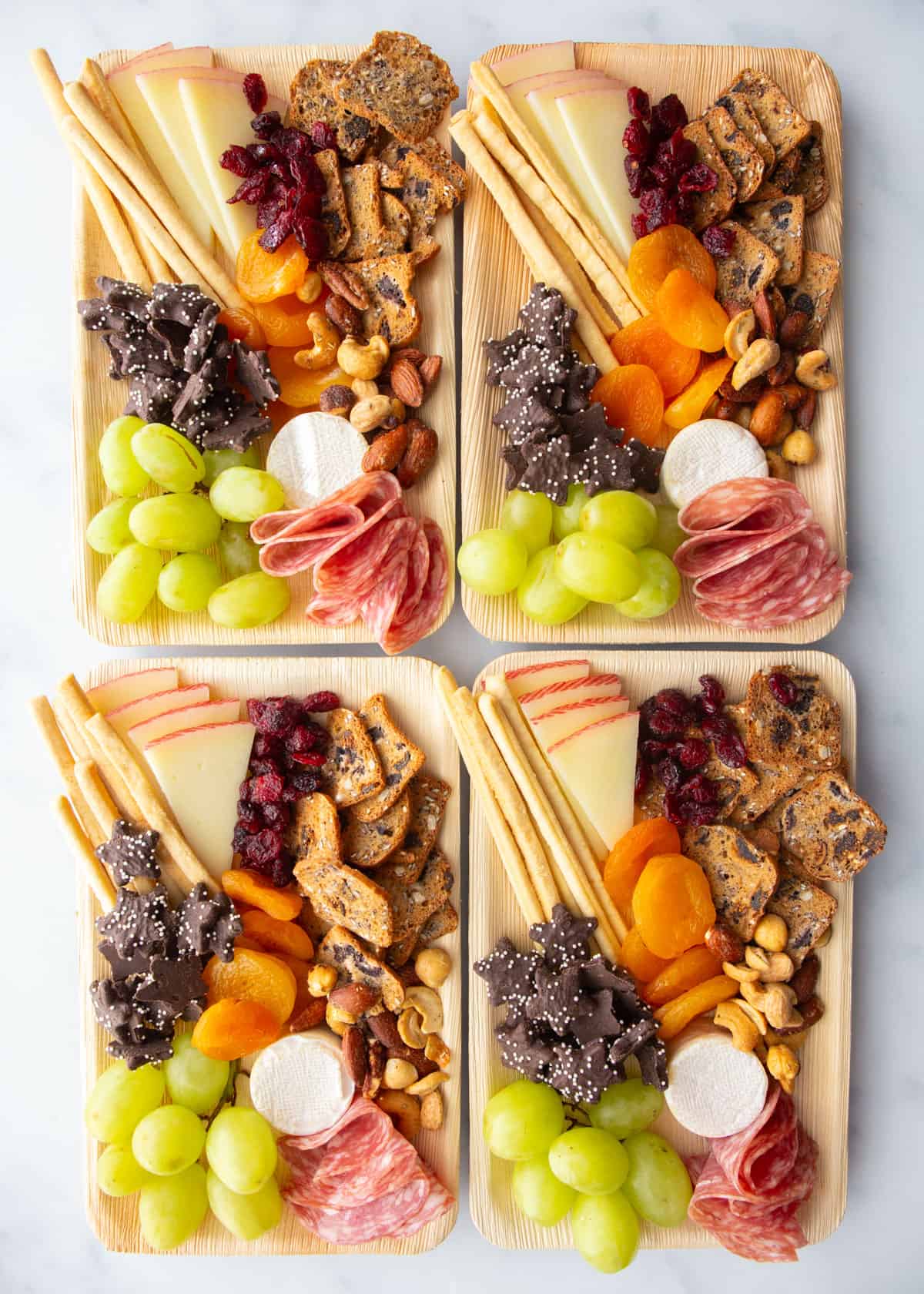 mini charcuterie boards on a grey countertop
