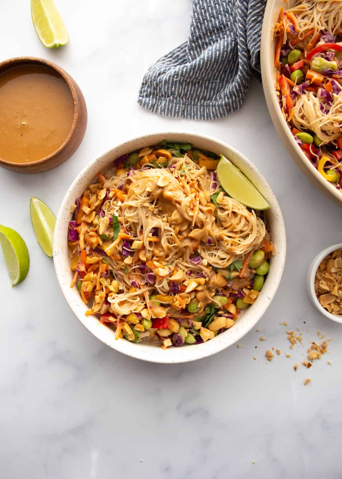 overhead image of rice noodle salad in a white bowl