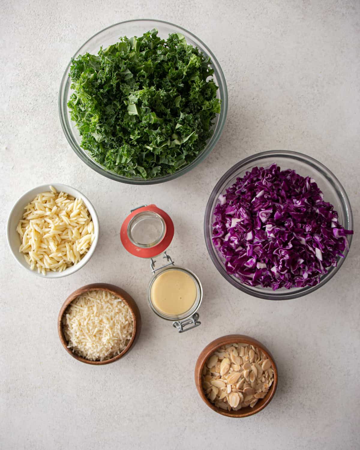 ingredients for kale salad on a grey countertop