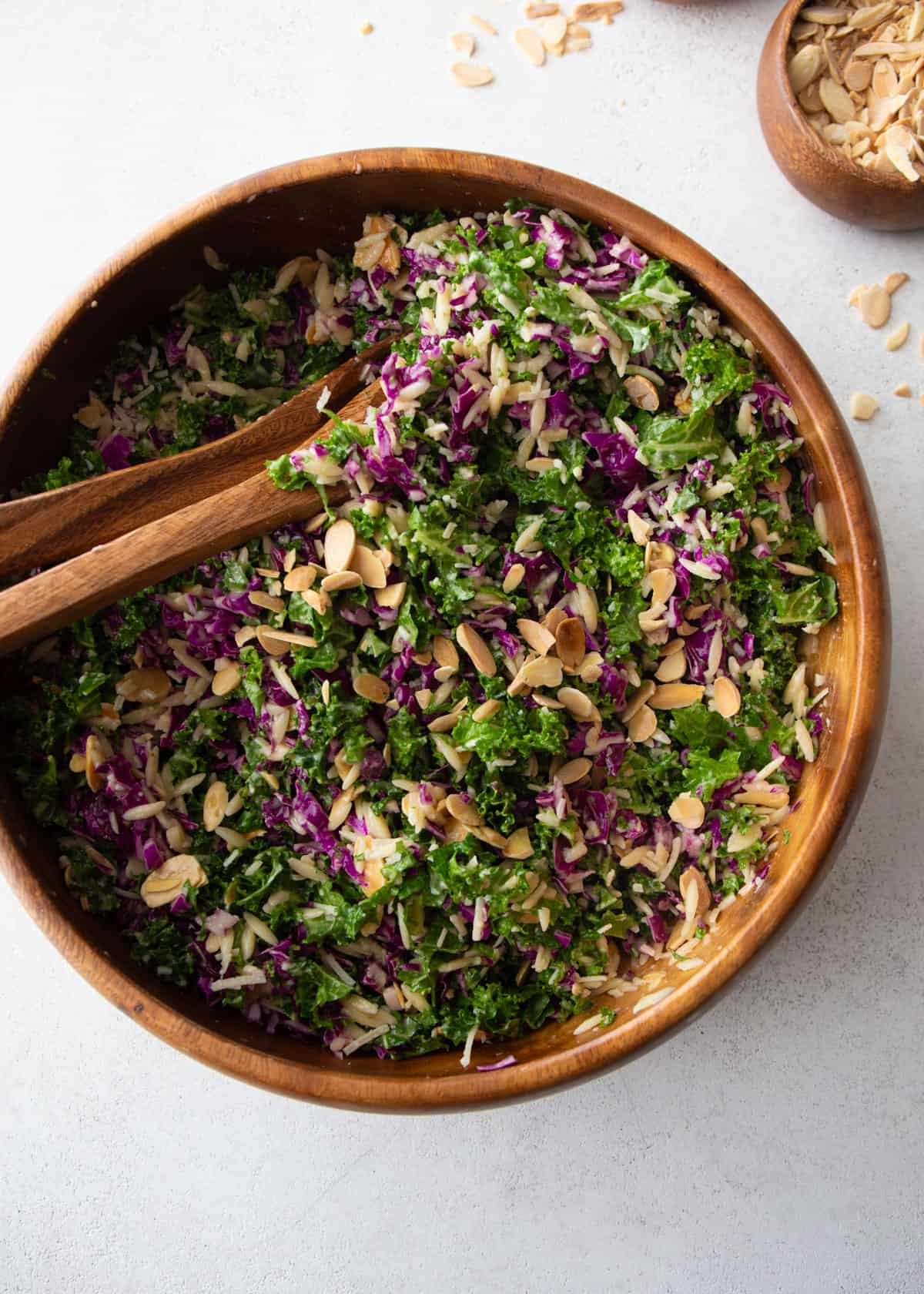 kale orzo salad in a large wooden bowl