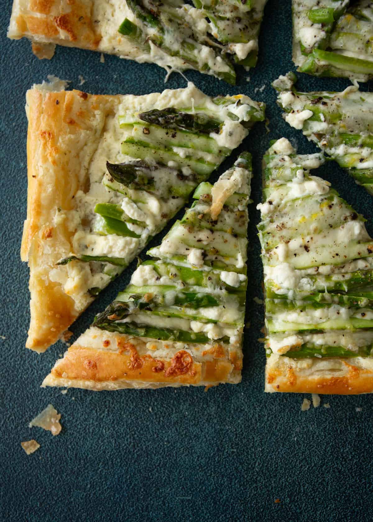 overhead image of asparagus puff pastry cut into triangles