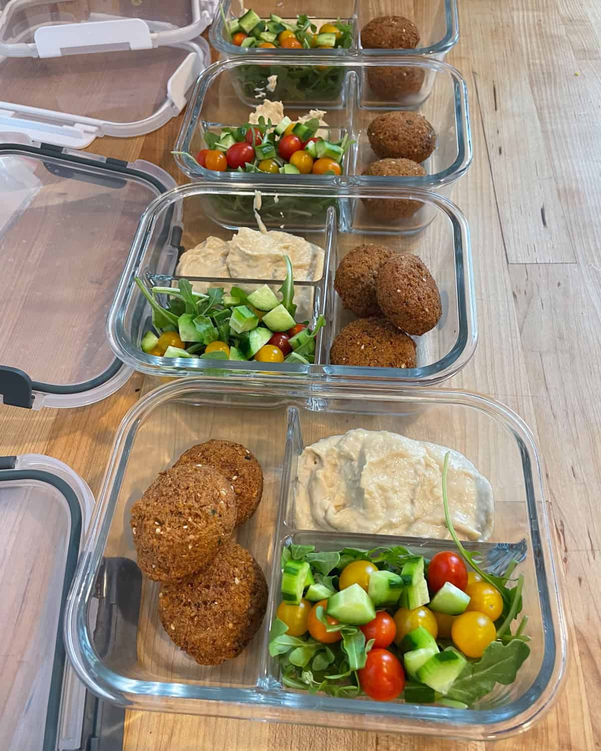 trays of hummus and toppings 