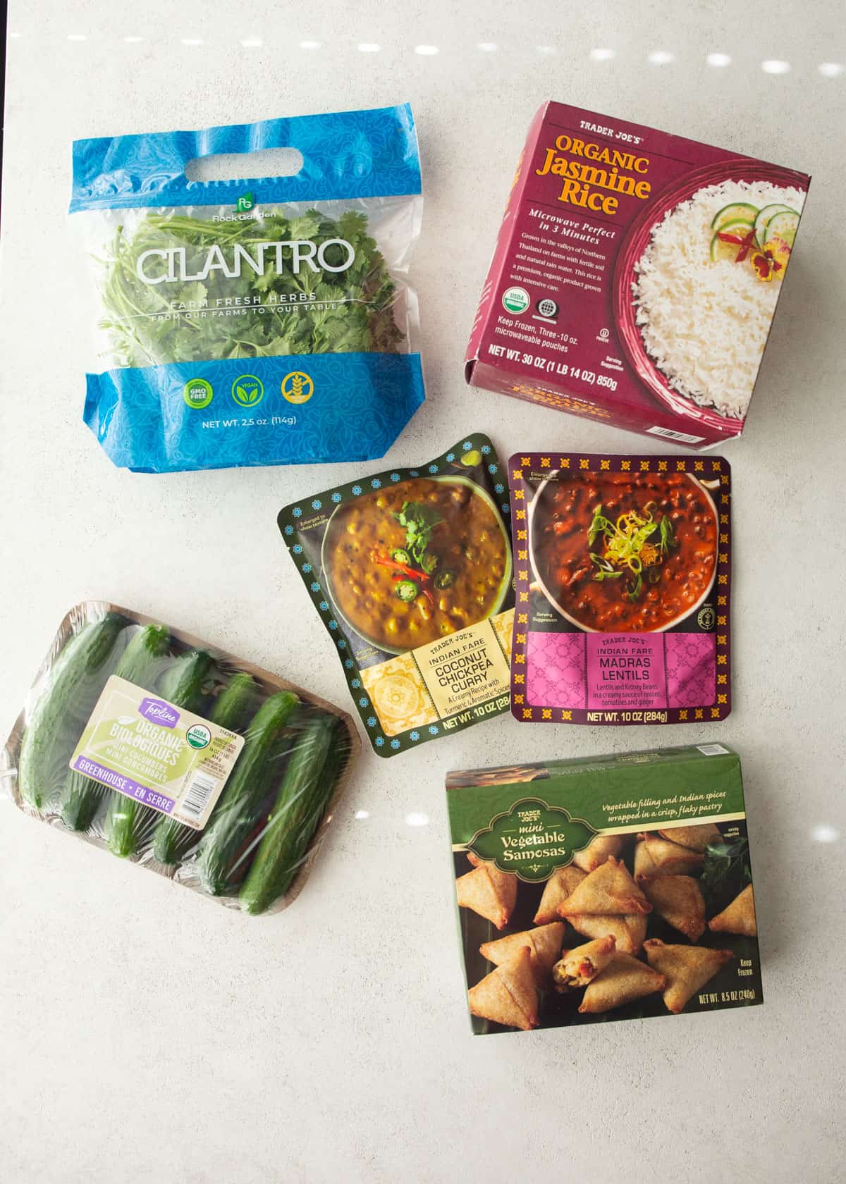 overhead image of curry ingredients on a grey countertop