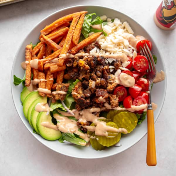 overhead image of veggie burger bowls on a white table