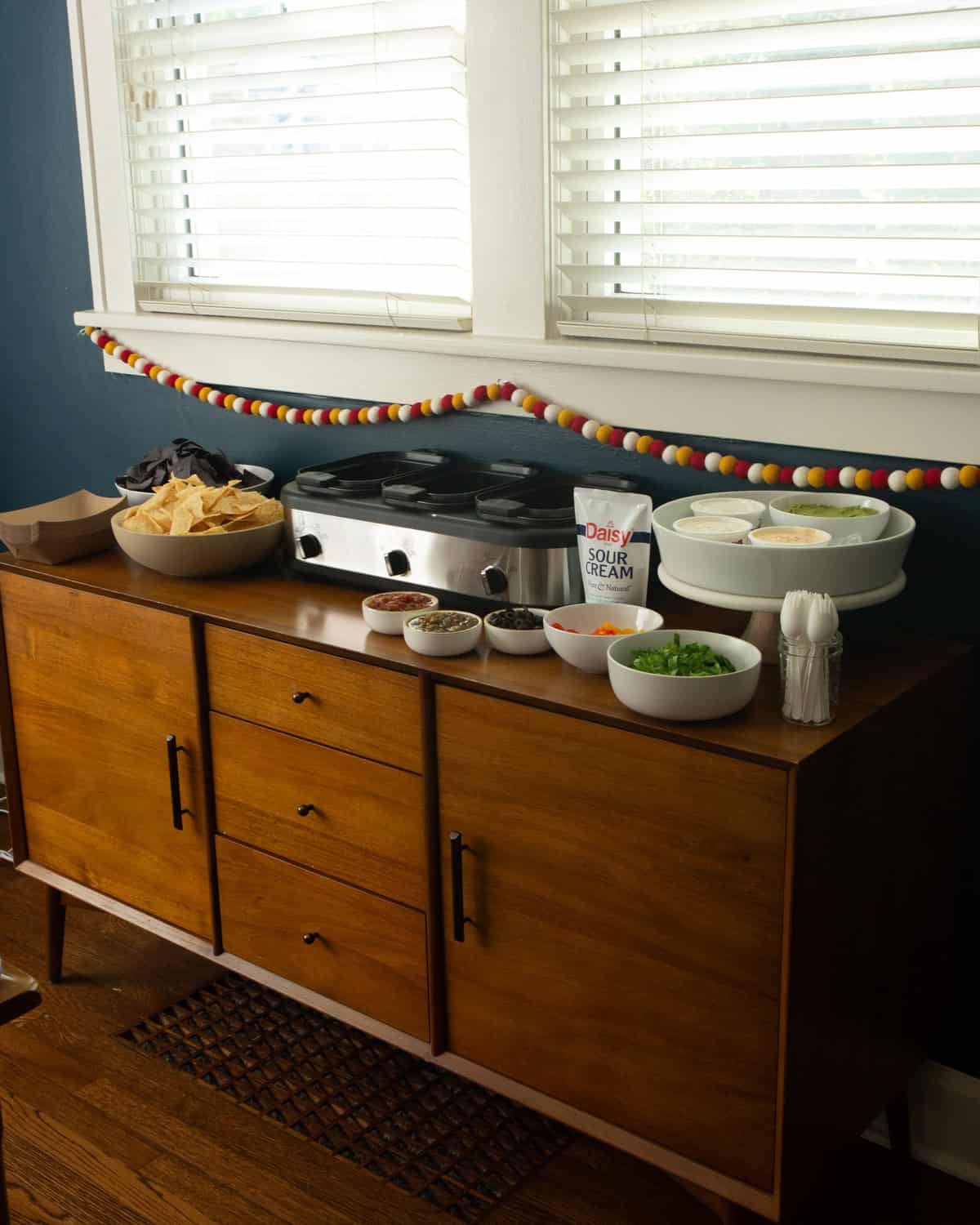 ingredients for nachos on a wood cabinet