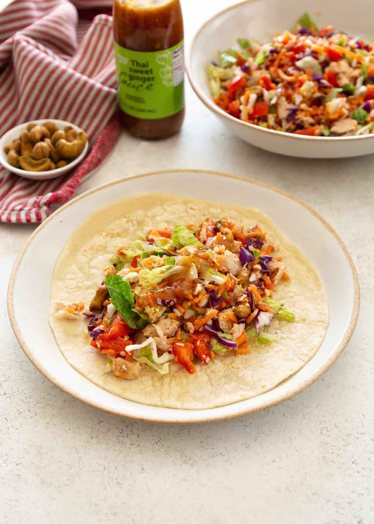 chopped chicken salad on a flour tortilla