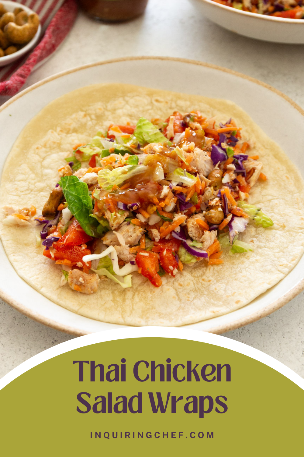 thai chopped chicken salad on a flour tortilla on a white plate