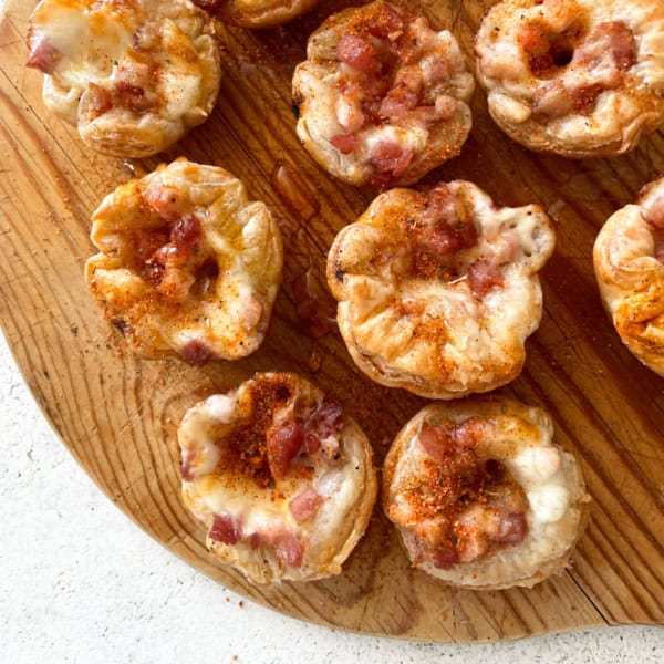 overhead image of puff pastry cups on a wooden cutting board