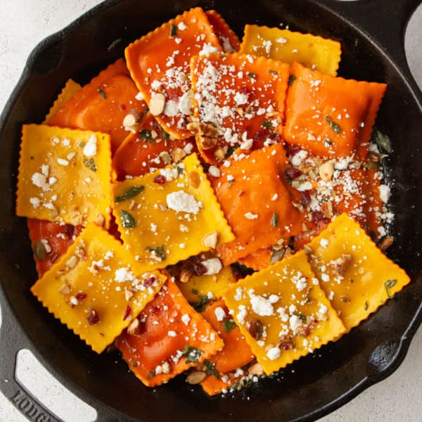 overhead image of pumpkin ravioli in a cast iron skillet