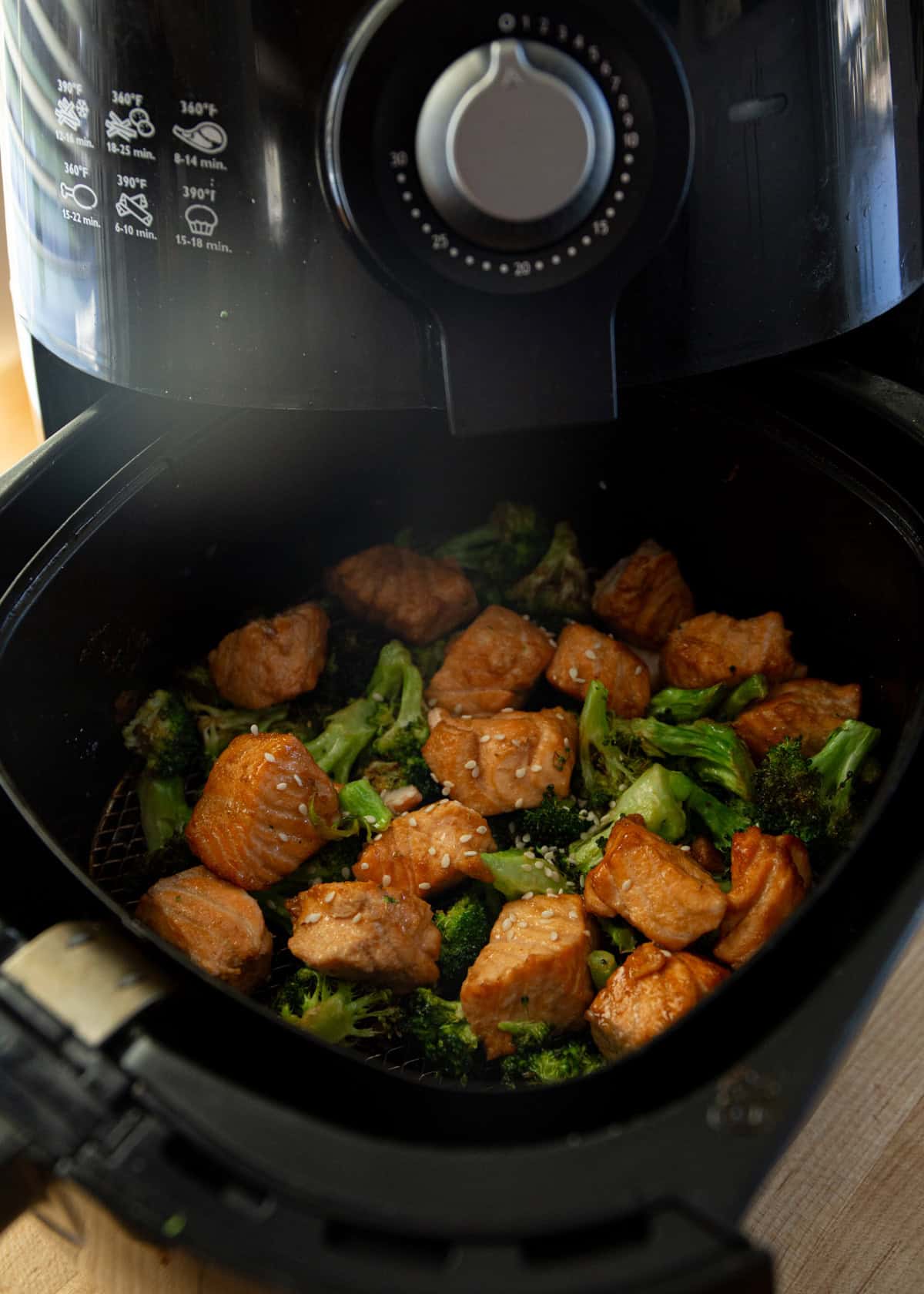 cooked salmon and broccoli in an air fryer