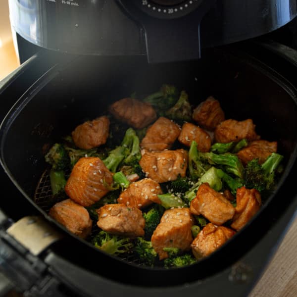 salmon and broccoli in an air fryer