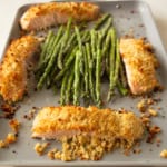 cooked salmon and asparagus on a sheet pan