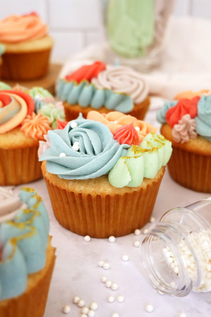 vanilla cupcake with multicolored floral icing