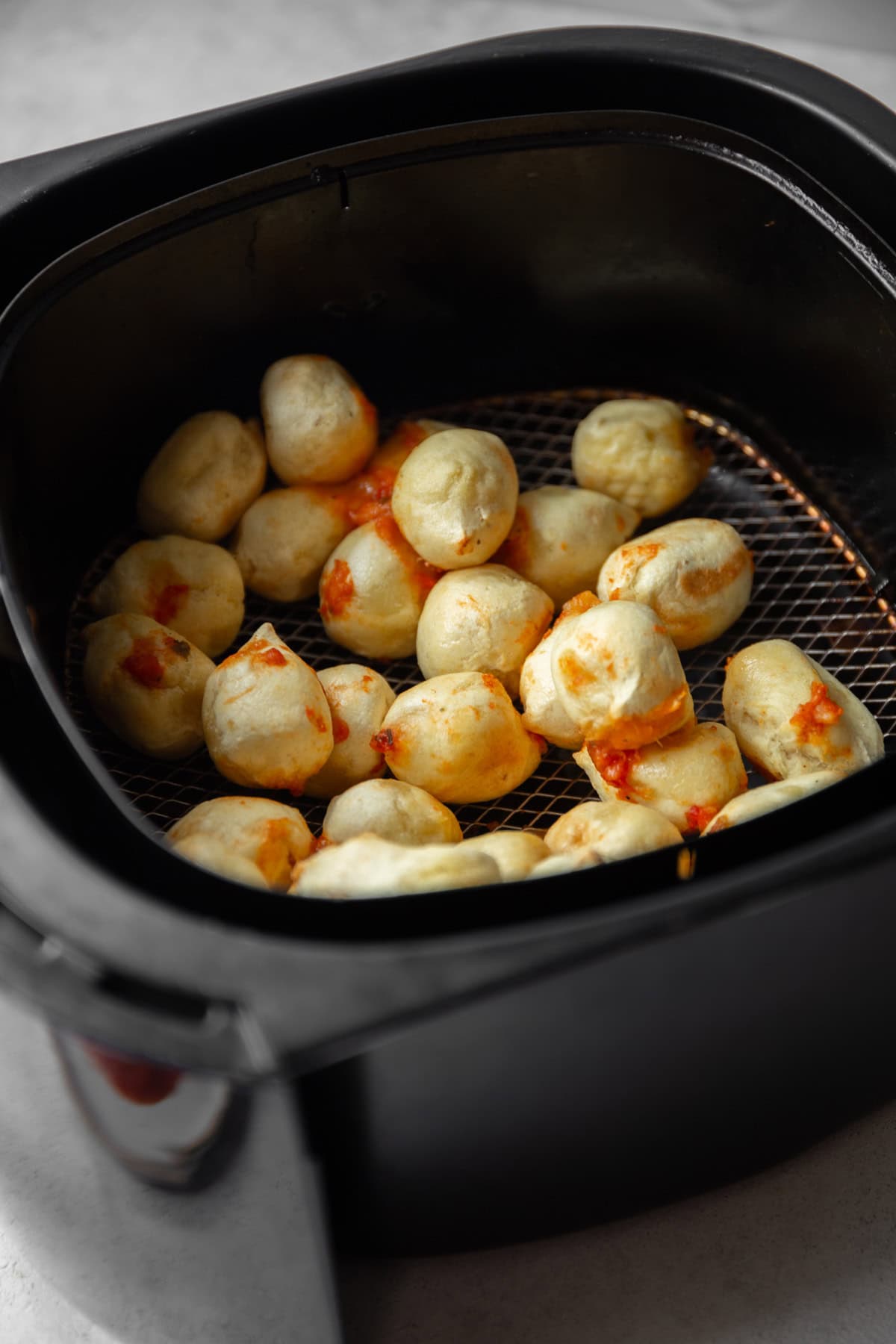stuffed gnocchi in an air fryer basket
