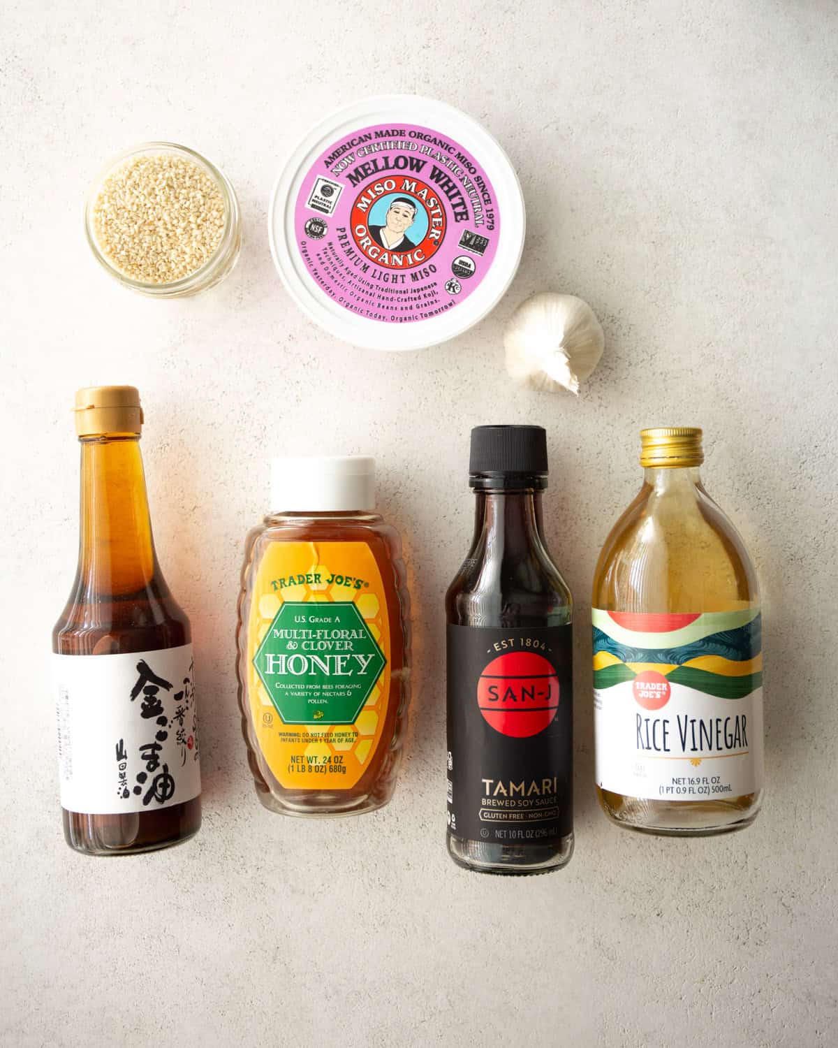 overhead image of ingredients for miso salad dressing on a white countertop