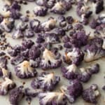 roasted purple cauliflower on a sheet pan