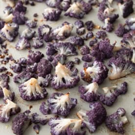 roasted purple cauliflower on a sheet pan