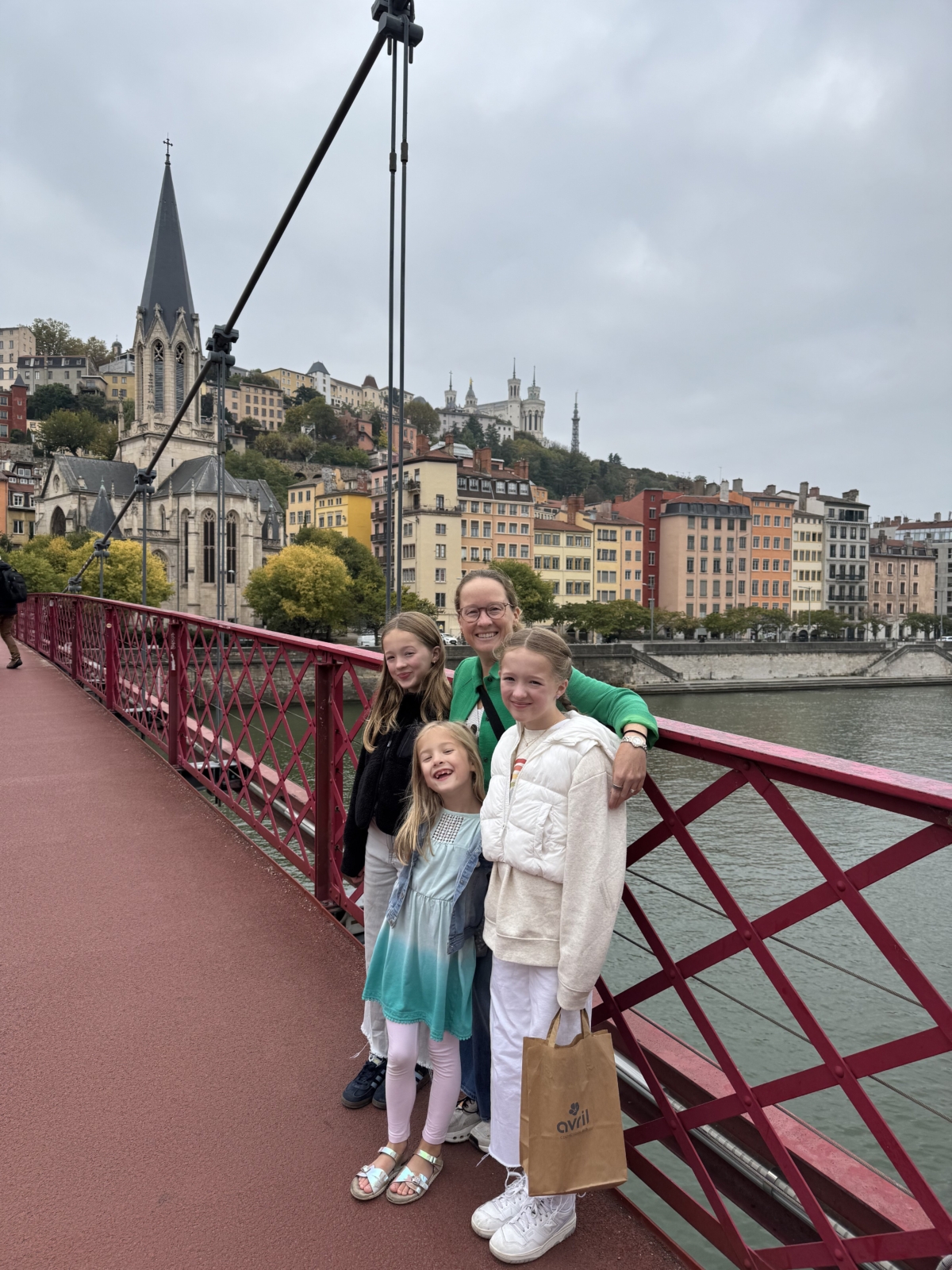 Jess and her three kids on a bridge in Lyon France