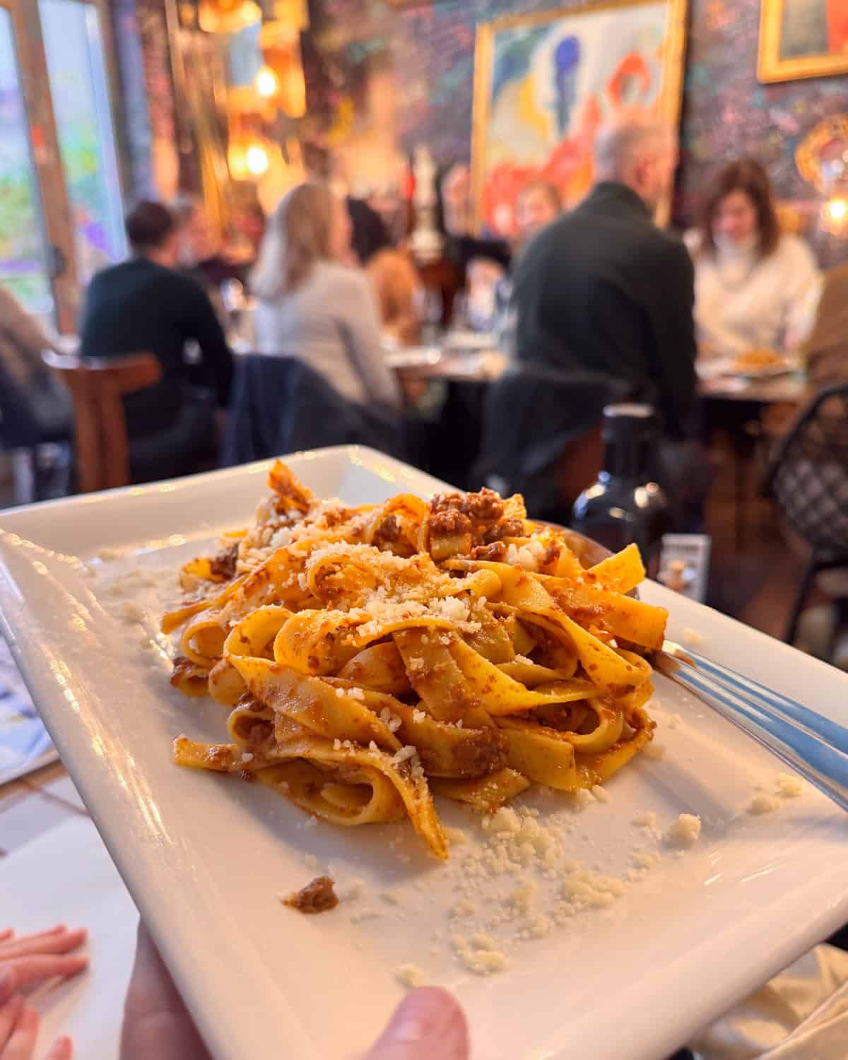 a plate of pasta with meat red sauce